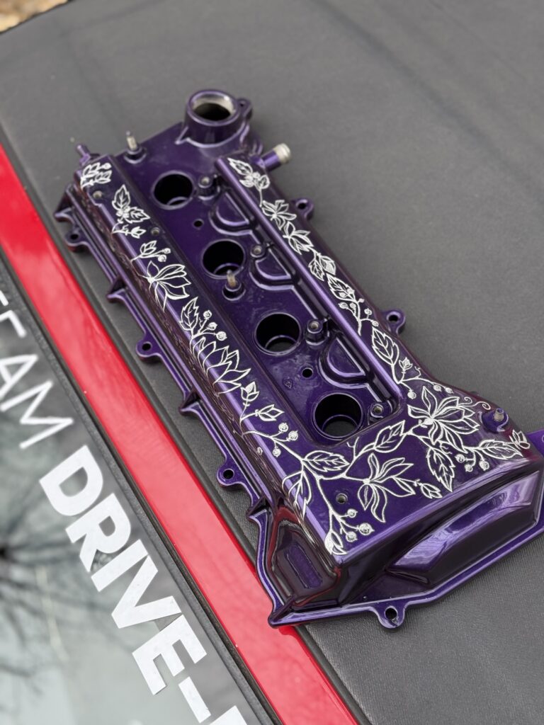 engraved floral art on a car toyota mr2 rocker cover bespoke art interesting design