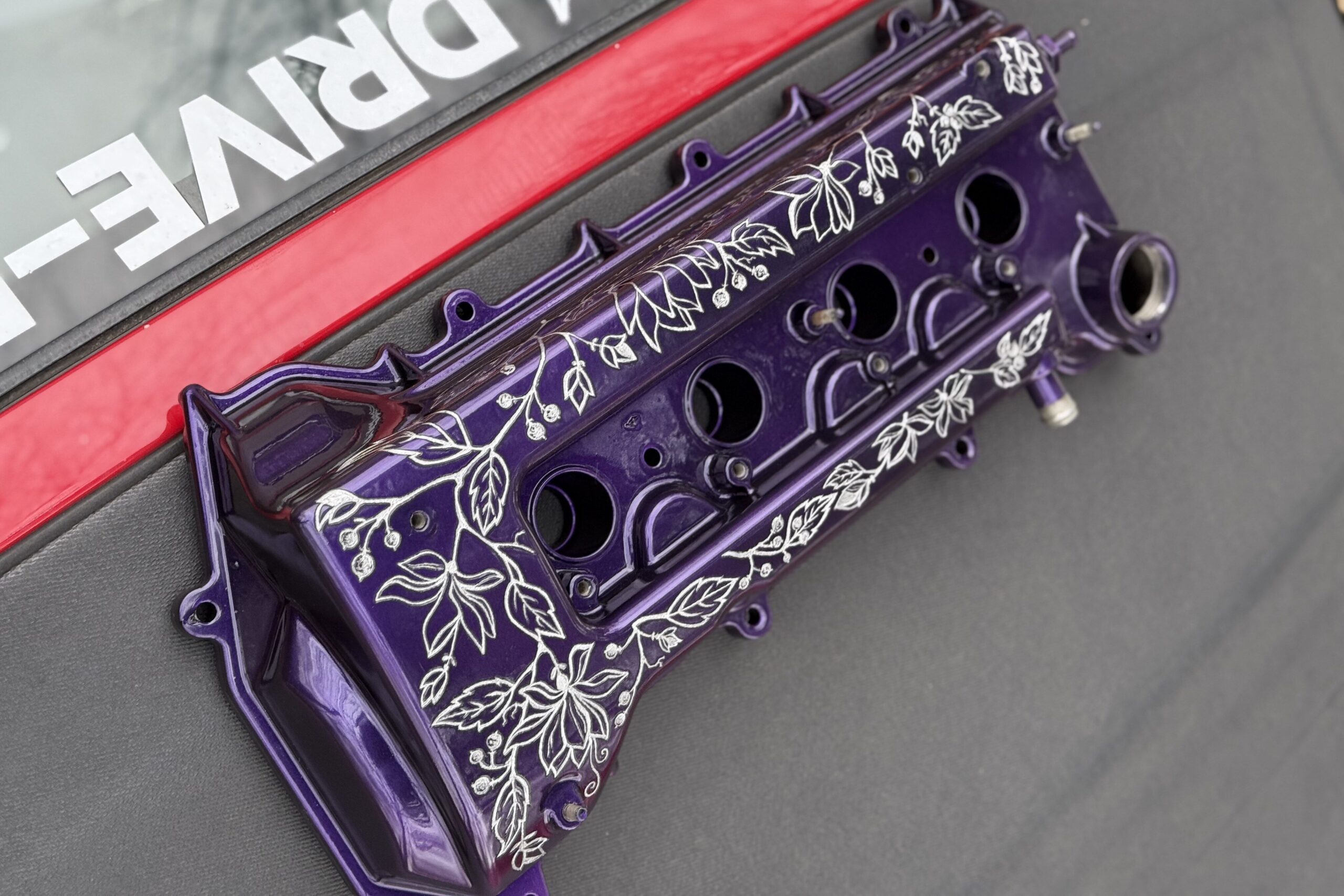 engraved floral art on a car toyota mr2 rocker cover bespoke art interesting design